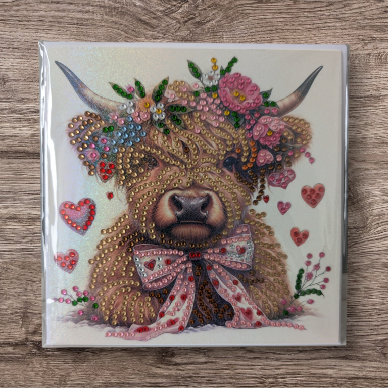 A cute Highland cow with a floral crown and a bow, surrounded by hearts.